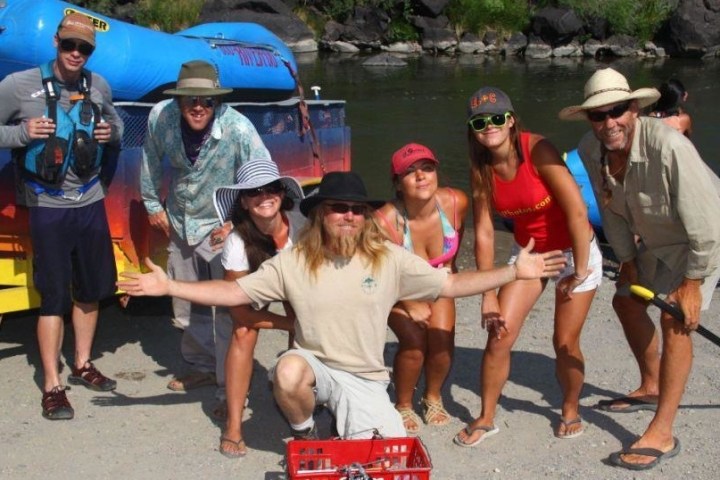 a group of people standing on a boat