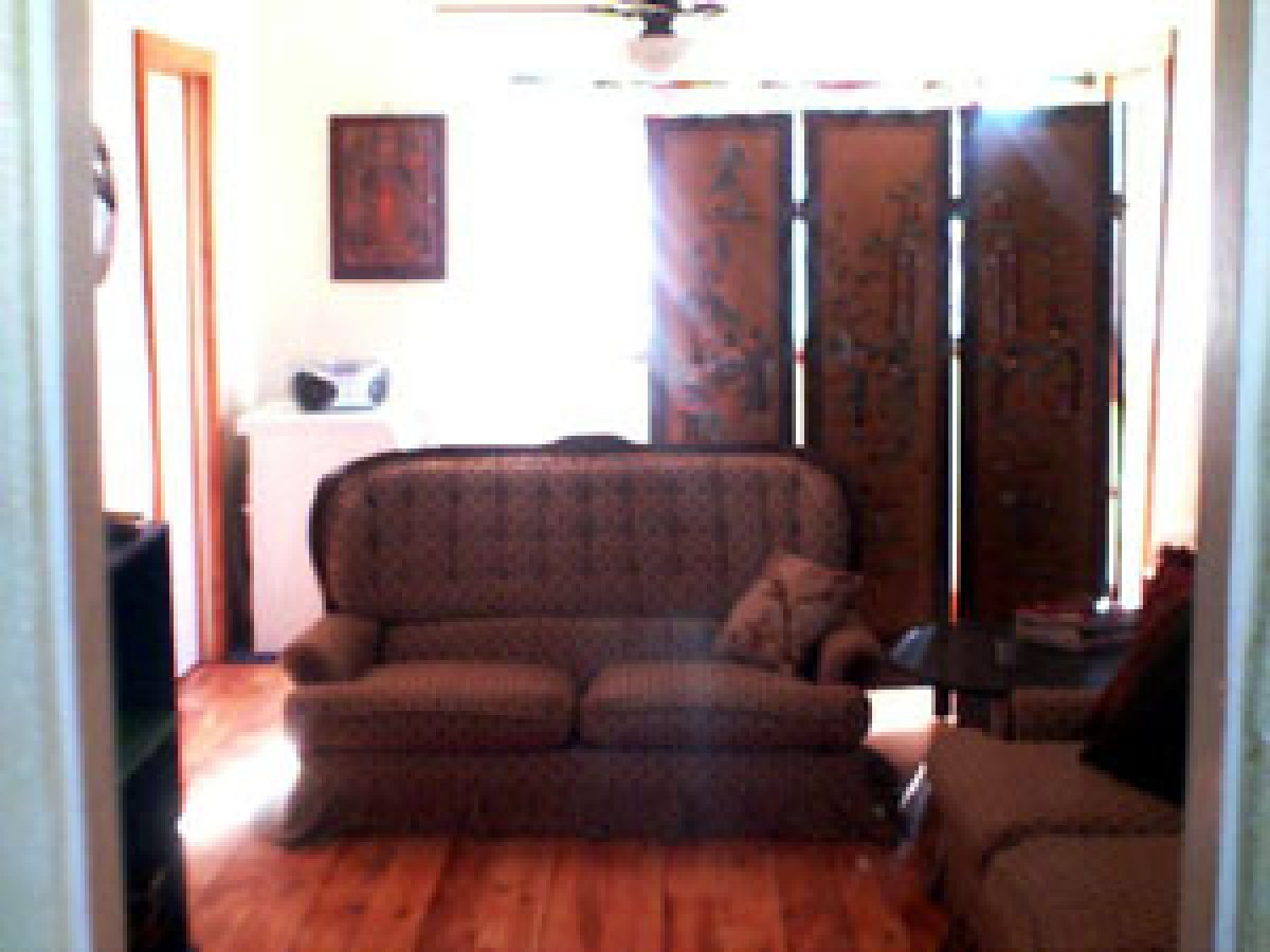 a living room filled with furniture and a fire place