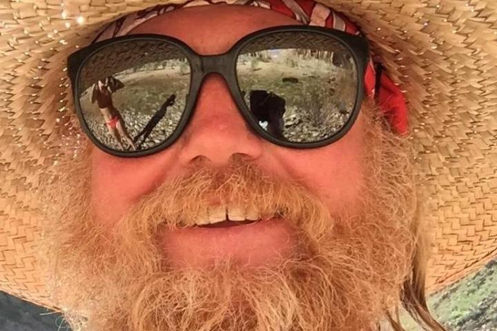 a man wearing sunglasses and a hat