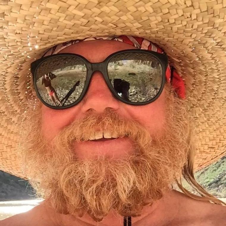 a man wearing sunglasses and a hat