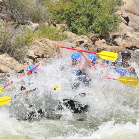 a man in a raft on the water