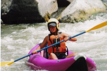 a person in a raft on the water