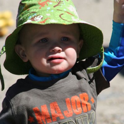 a little boy wearing a hat